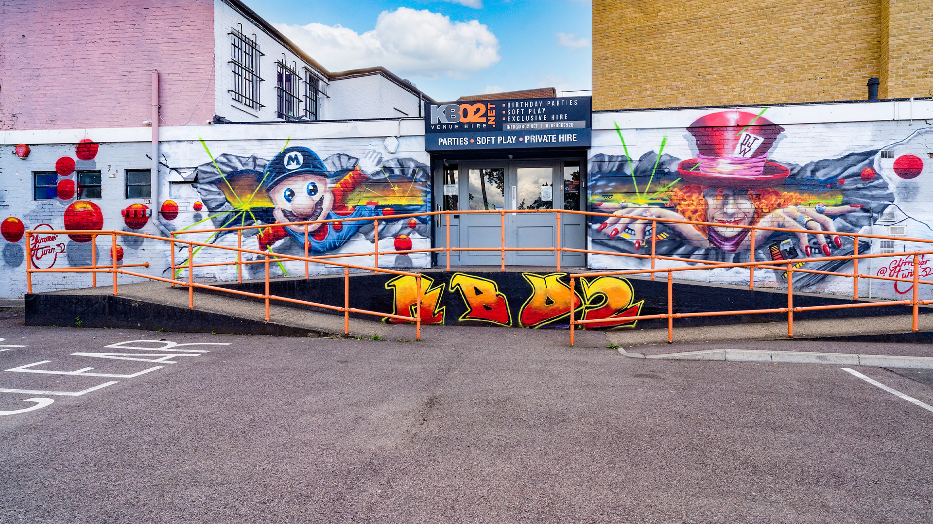 Venue exterior with murals